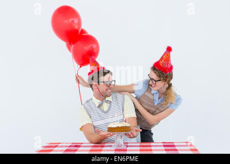 Geeky hipster couple celebrating his birthday Stock Photo