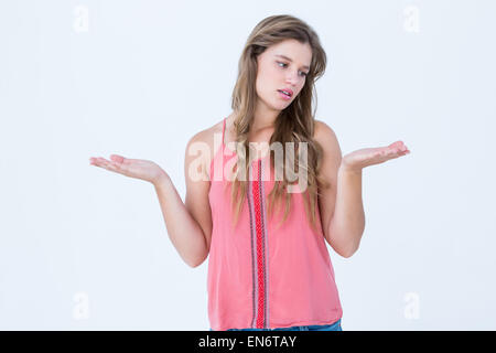 Unsure woman gesturing do not know sign Stock Photo