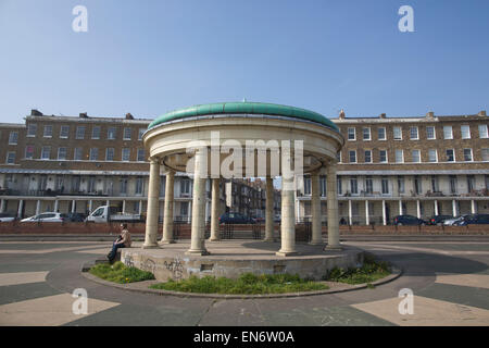 Georgian terraced houses on Wellington Crescent, and the Band Stand on Prince Edward's Promenade, Ramsgate, Kent, England, UK Stock Photo