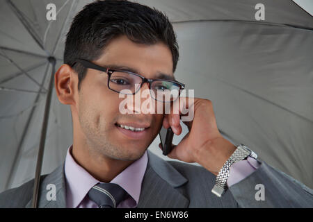 Businessman talking on mobile phone Stock Photo
