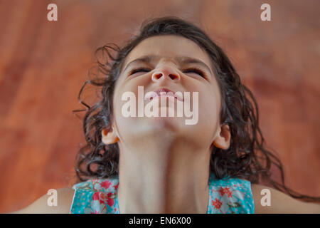 Little girl making a face Stock Photo