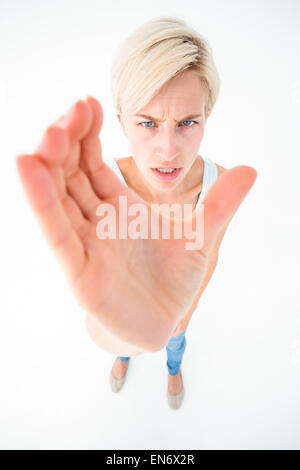 Angry woman taking something Stock Photo