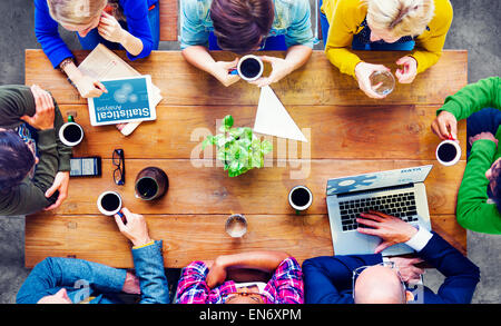 Diverse People Using Technologies and Talking Stock Photo