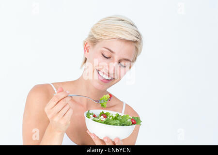 Beautiful blonde woman eating salad Stock Photo