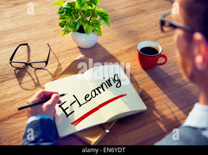 Businessman Writing the Word E-Learning Stock Photo