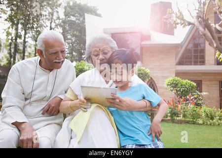 Portrait of family sitting together Stock Photo