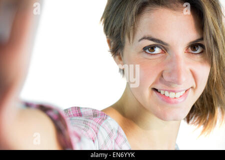 Casual brunette taking a selfie Stock Photo - Alamy