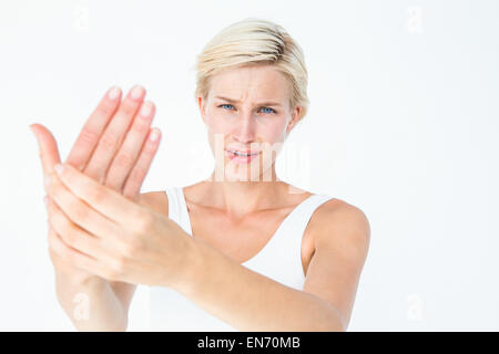 Pretty woman suffering from hand pain Stock Photo