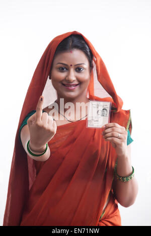 Portrait of rural woman with voters mark and identity card Stock Photo ...