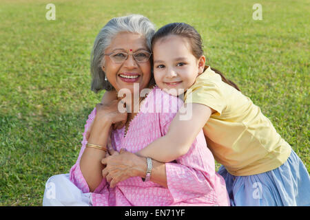 Portrait of grandmother and granddaughter smiling Stock Photo