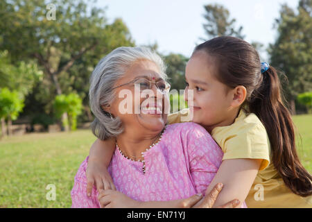 Grandmother and granddaughter smiling Stock Photo