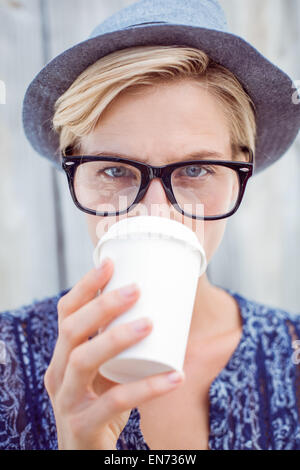 Pretty blonde woman drinking coffee Stock Photo