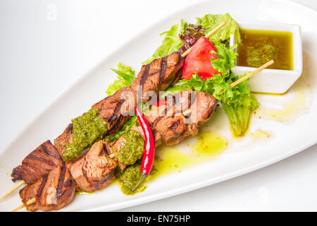 Skewered Meat with and sauce Stock Photo