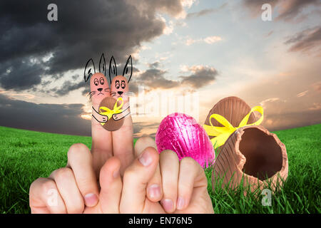 Composite image of fingers as easter bunny Stock Photo