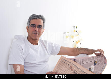 Man reading the newspaper Stock Photo