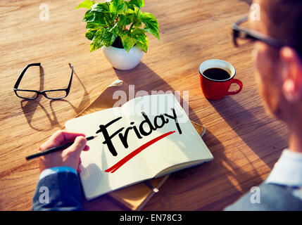 Man with Note Pad and Friday Concept Stock Photo