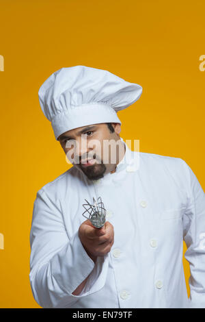 Portrait of chef holding wire whisk Stock Photo