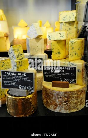 Stilton Cheeses on Sale at Neal's Yard Cheese Shop, Covent Garden, London, England, UK Stock Photo