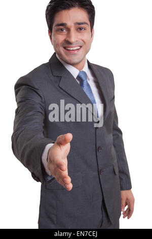 Portrait of a businessman extending a hand to shake Stock Photo