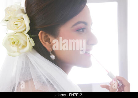 Bride wearing make up Stock Photo