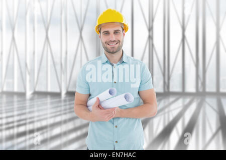 Composite image of happy male architect holding blueprints Stock Photo