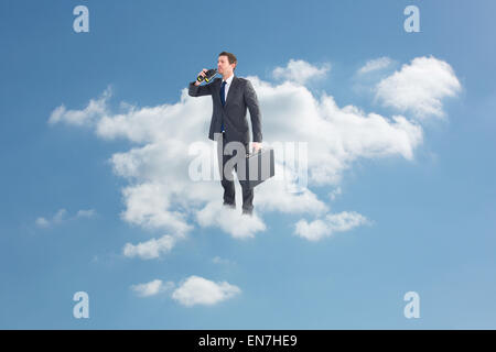 Composite image of businessman looking through binoculars Stock Photo