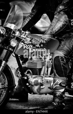 Biker on a Royal Enfield motorcycle. Sepia Toned Stock Photo