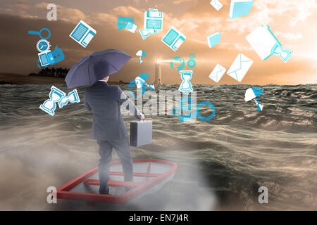 Composite image of businessman in boat with umbrella Stock Photo