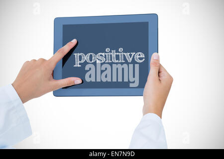 Positive against doctor using tablet pc Stock Photo