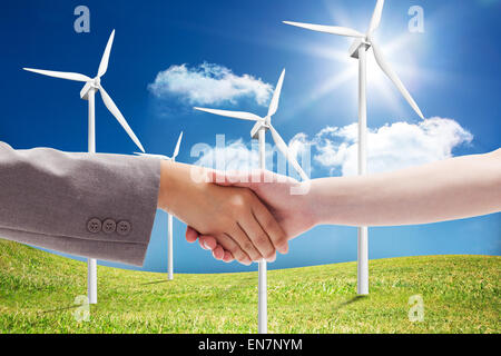 Composite image of handshake between two women Stock Photo