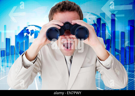 Composite image of positive businessman using binoculars Stock Photo