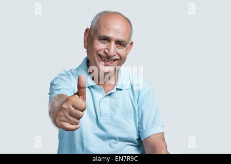 Old man giving thumbs up Stock Photo