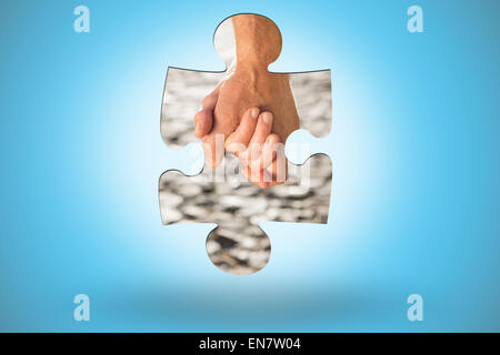 Composite image of happy senior couple holding hands Stock Photo