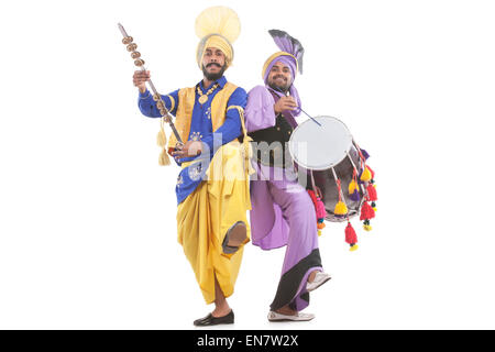 Portrait of Sikh men doing bhangra dance Stock Photo