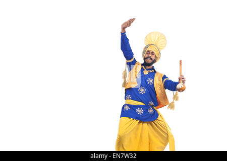 Portrait of Sikh man doing bhangra dance Stock Photo