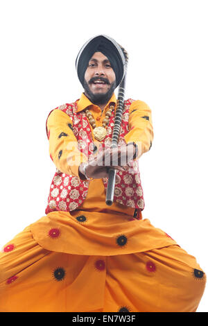 Portrait of Sikh man doing bhangra dance Stock Photo