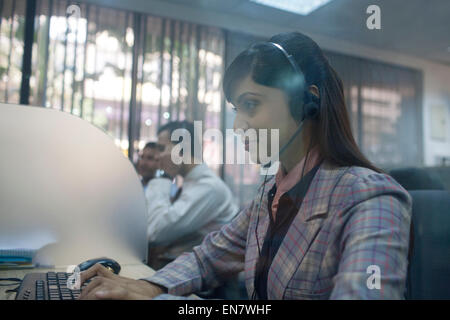 Side profile of female executive working Stock Photo