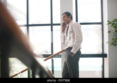 Executive talking on mobile phone Stock Photo