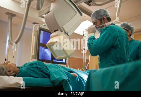 Doctors performing operation Stock Photo