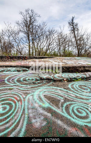 Subsidence cracks on Route 61 or Graffiti Highway in Centralia, PA where a mine fire that began in 1962 continues to burn to this day. Stock Photo