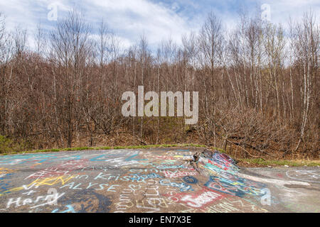 Subsidence cracks on Route 61 or Graffiti Highway in Centralia, PA where a mine fire that began in 1962 continues to burn to this day. Stock Photo