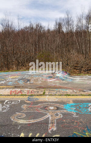 Subsidence cracks on Route 61 or Graffiti Highway in Centralia, PA where a mine fire that began in 1962 continues to burn to this day. Stock Photo