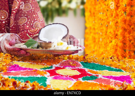 Close-up of a Brides hand holding pooja thali Stock Photo