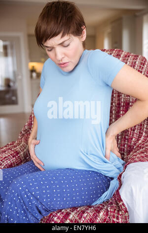 Pregnant woman getting a contraction Stock Photo