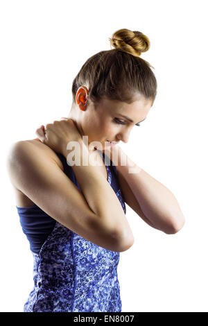 Fit brunette with neck injury Stock Photo