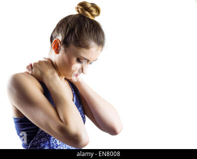 Fit brunette with neck injury Stock Photo