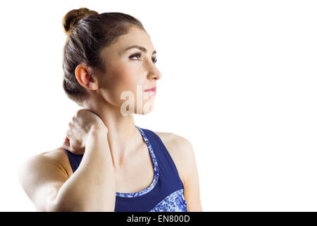 Fit brunette with neck injury Stock Photo