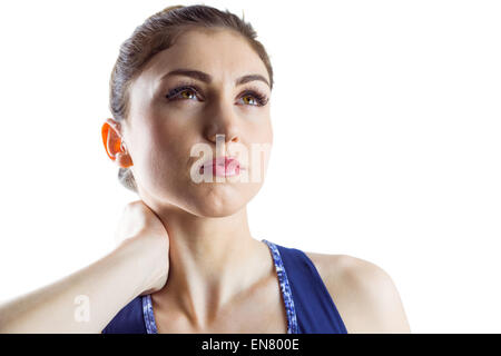 Fit brunette with neck injury Stock Photo