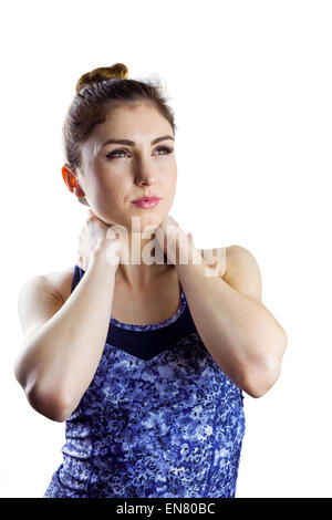 Fit brunette with neck injury Stock Photo