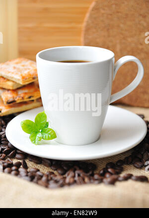 White cup of coffee and tasty cookie Stock Photo